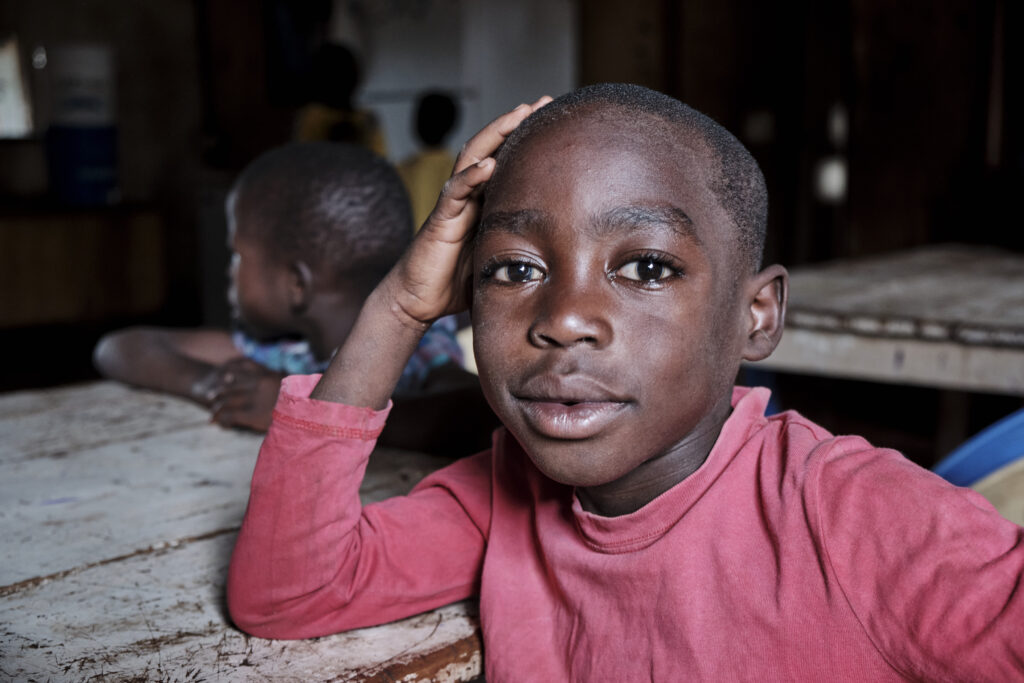 A boy posing for portrait. Praise Gate Foster Home for former street children, Kenya, 2017